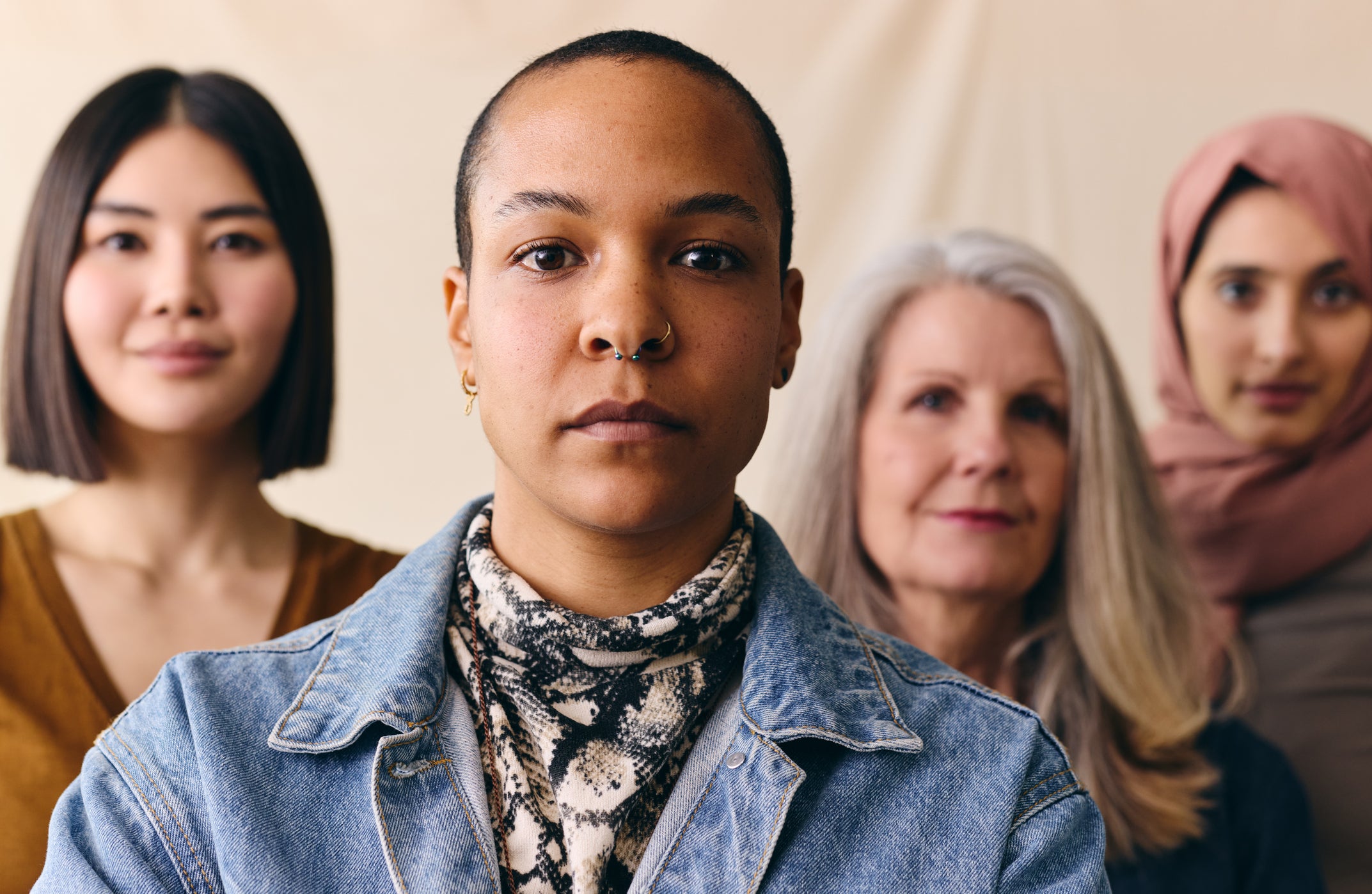 FinDev Canada’s evaluation of 2X Challenge investments: Image of a group of women posing and looking straight into the camera. FinDev Canada logo in the bottom left.
